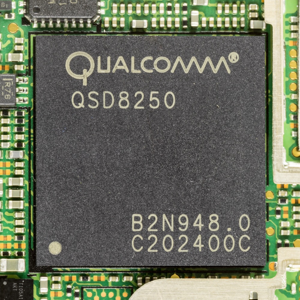 Real photo: an early Qualcomm Snapdragon QSD8250 chip on an HTC Desire phone board